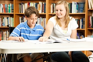 Teacher works with a student in a wheelchair